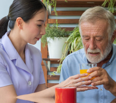 image of the senior patient assisted by the home care staff