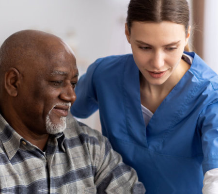 image of the senior man patient and the home care staff